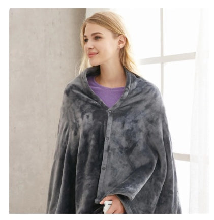 Eluppvärmd poncho i mjukaste korallfleece